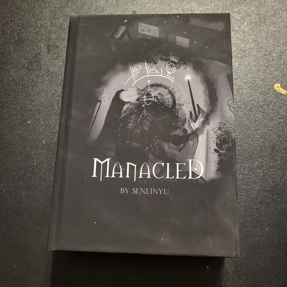 Manacled by Senlinyu Hardcover Book